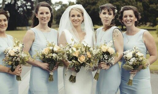 Bride with bridesmaids and yellow bouquets Northamptonshire wedding